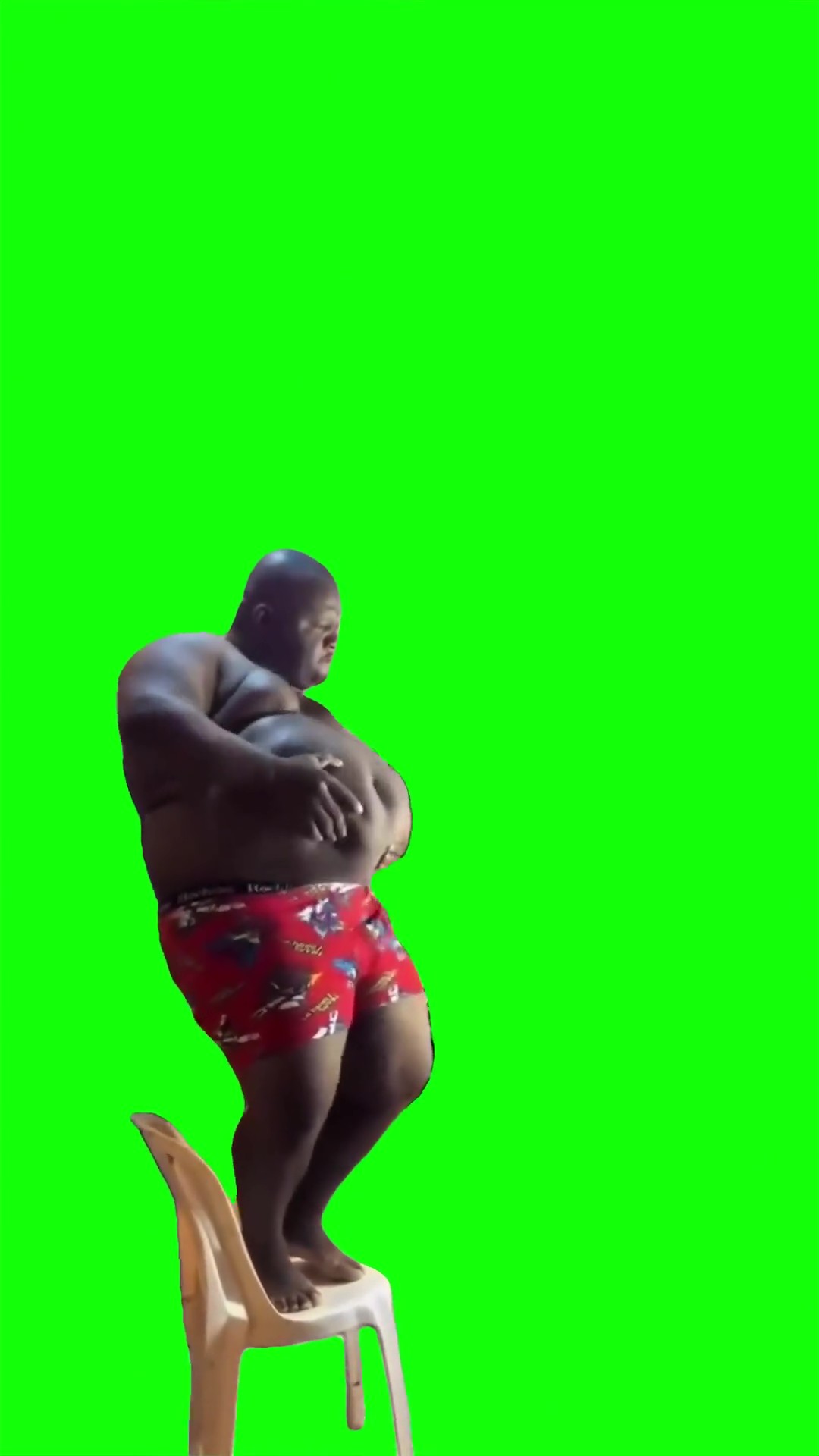 Guy dancing on a chair green screen