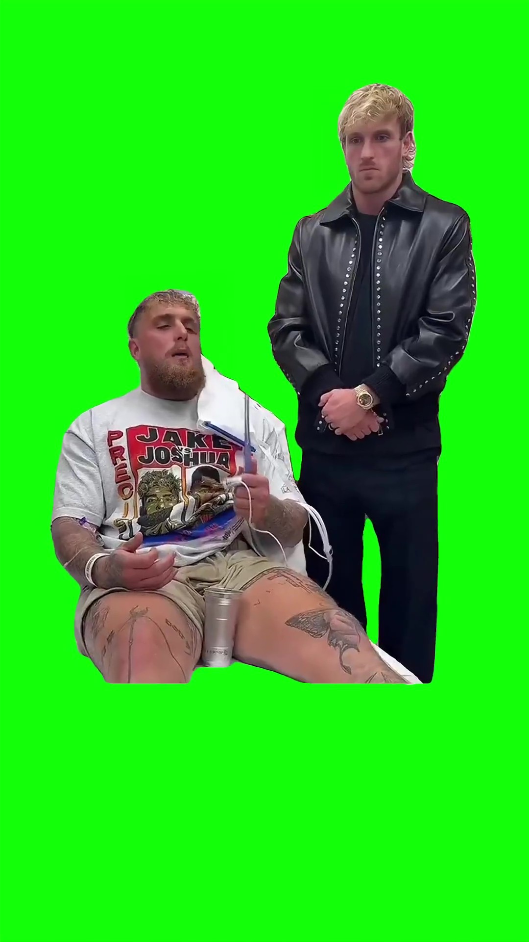 Logan standing next to Jake green screen