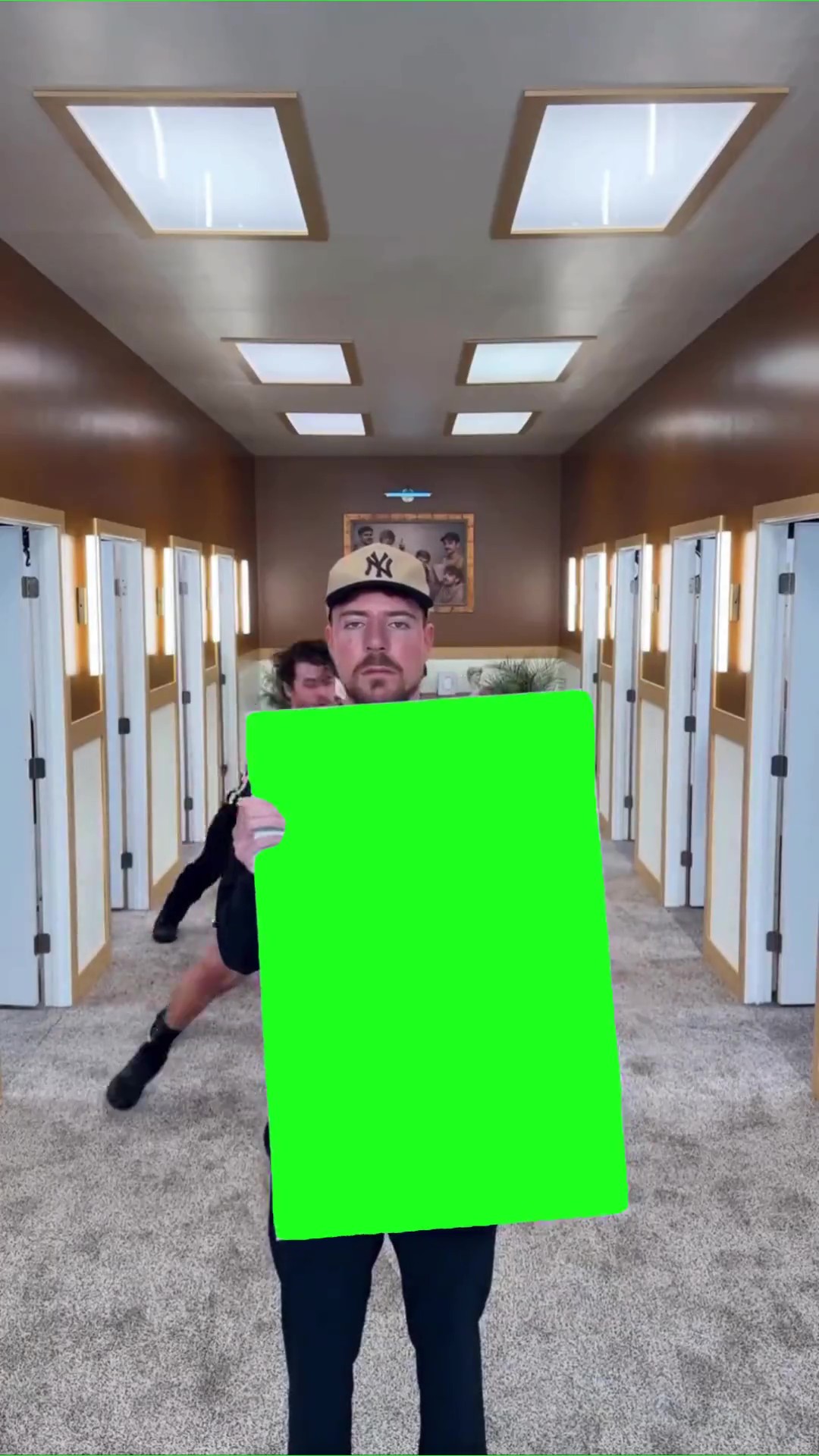 Mr beast holding a sign green screen